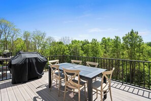 A deck with a table and chairs, a grill, and a view of trees. - Spacious Homes w/ Hot Tubs near Ark Encounter, Parking (Dry Ridge)