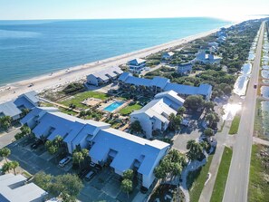 A coastal hotel with multiple buildings, a swimming pool, and a beach view. - New- Ocean Mile Retreat | Pet Friendly | 2 Pools (Saint George Island)