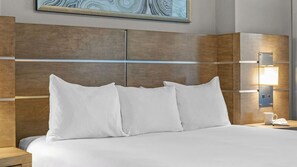 A hotel room with a large bed, a nightstand, a lamp, and a painting on the wall. - 1BR at Club Wyndham Desert Blue Near the Las Vegas Strip & Attractions (Las Vegas)