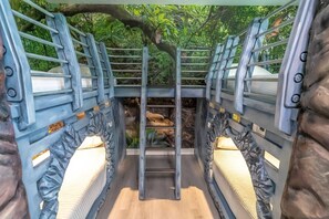 A bridge with metal railings and a wooden floor, surrounded by greenery. - New Listing | Choose Your Own Adventure! 4 Themed Rooms, a Private Arcade and a Pool | Sleeps 25! (Kissimmee)