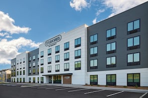 A modern hotel building with a sign reading 'STUDIORES BY MARRIOTT' on the facade. - StudioRes by Marriott Mobile (Mobile)