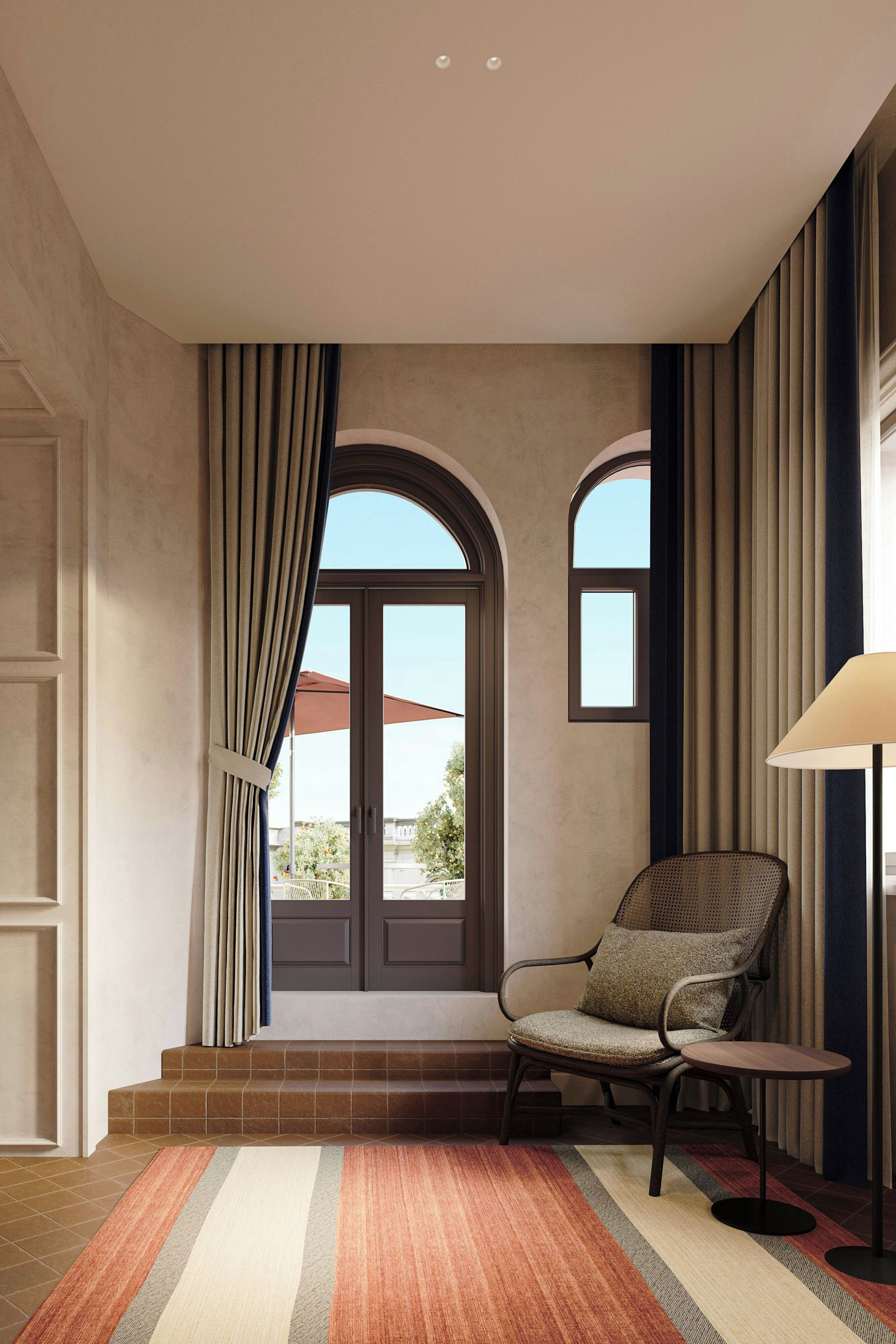 A room with a large window, a chair, a lamp, and a striped rug.