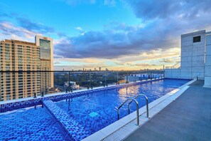 A rooftop pool with a cityscape view, a high-rise building labeled 'GTC Residence,' and a clear sky. - 16th Floor Luxury -GTC Skyline Views with gym and workspace (Nairobi)
