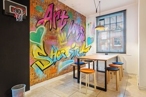 Hand-painted graffiti wall by a local Shoreditch artist- a one-of-a-kind feature you won’t find anywhere else in London - Design-Led Shoreditch Flat | Graffiti • Brick Lane (Greater London)