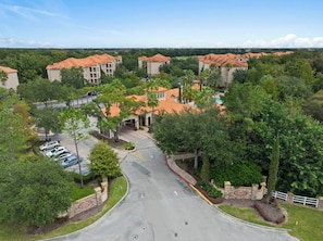 Aerial view of a lush resort-style community with gated entry - Poolside Stay | Private Balcony | Near Disney (Davenport)