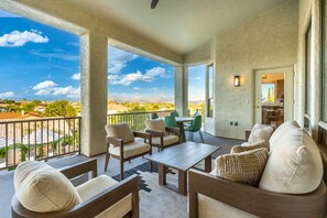 A covered outdoor seating area with a view of the landscape. - NEW|The Beaumont @ Bainbridge|Heated Pool|FirePit (Fountain Hills)