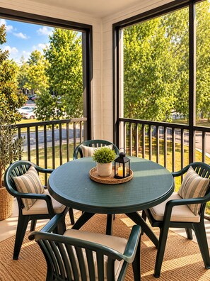 A balcony with a round table, chairs, and a potted plant. - The Athens Playbook w/ Pool & Shuttle! (Athens)