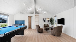 A modern indoor space with a pool table, comfortable seating, and a TV. - VillaVilla 1007 - Henne Strand, Vestjylland (Henne)