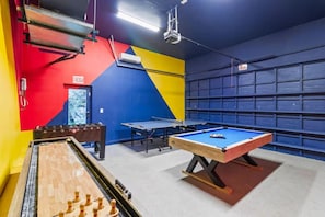 A recreational area with a foosball table, ping pong table, and pool table. - Modern Luxe 2021Built Heated Pool/Jacuzzi/Gameroom (Fort Lauderdale)