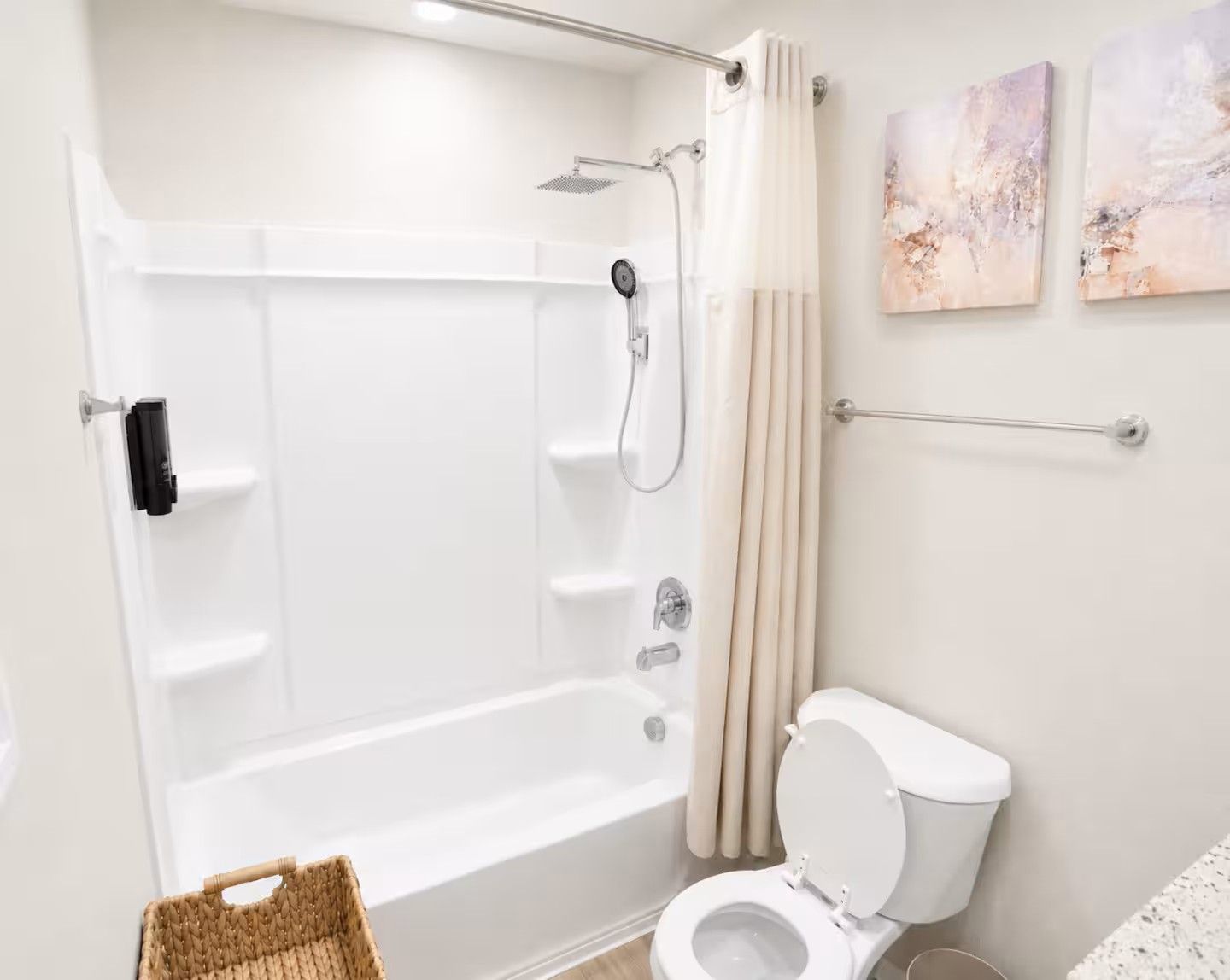 A bathroom with a bathtub, toilet, and shower.