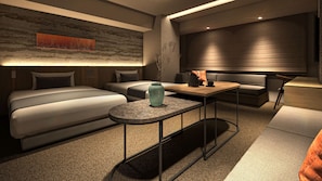 A modern hotel room with a sofa, a small table, and a decorative vase. - Minn Kyoto Shijo (Kyoto)