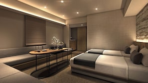A modern hotel room with a sofa, a small table, and a bed.