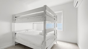 A bunk bed in a room with white walls and a window. - Cormorant Retreat Family-Friendly Torquay Escape (Torquay)