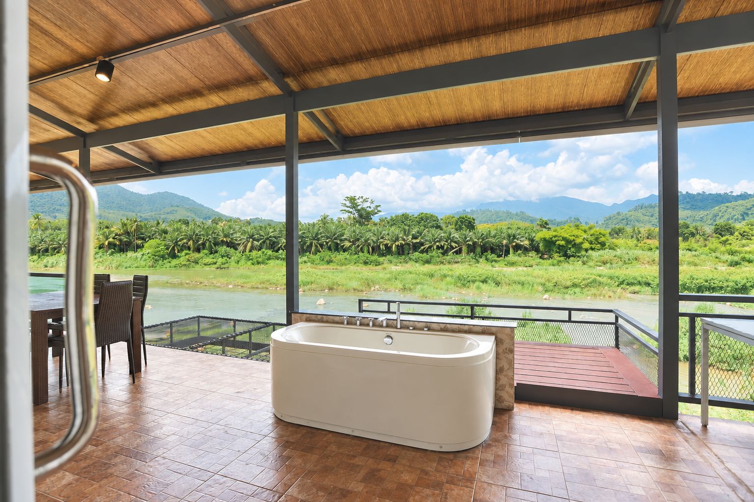 A spa area with a large bathtub, a dining table with chairs, and a view of a river and greenery.