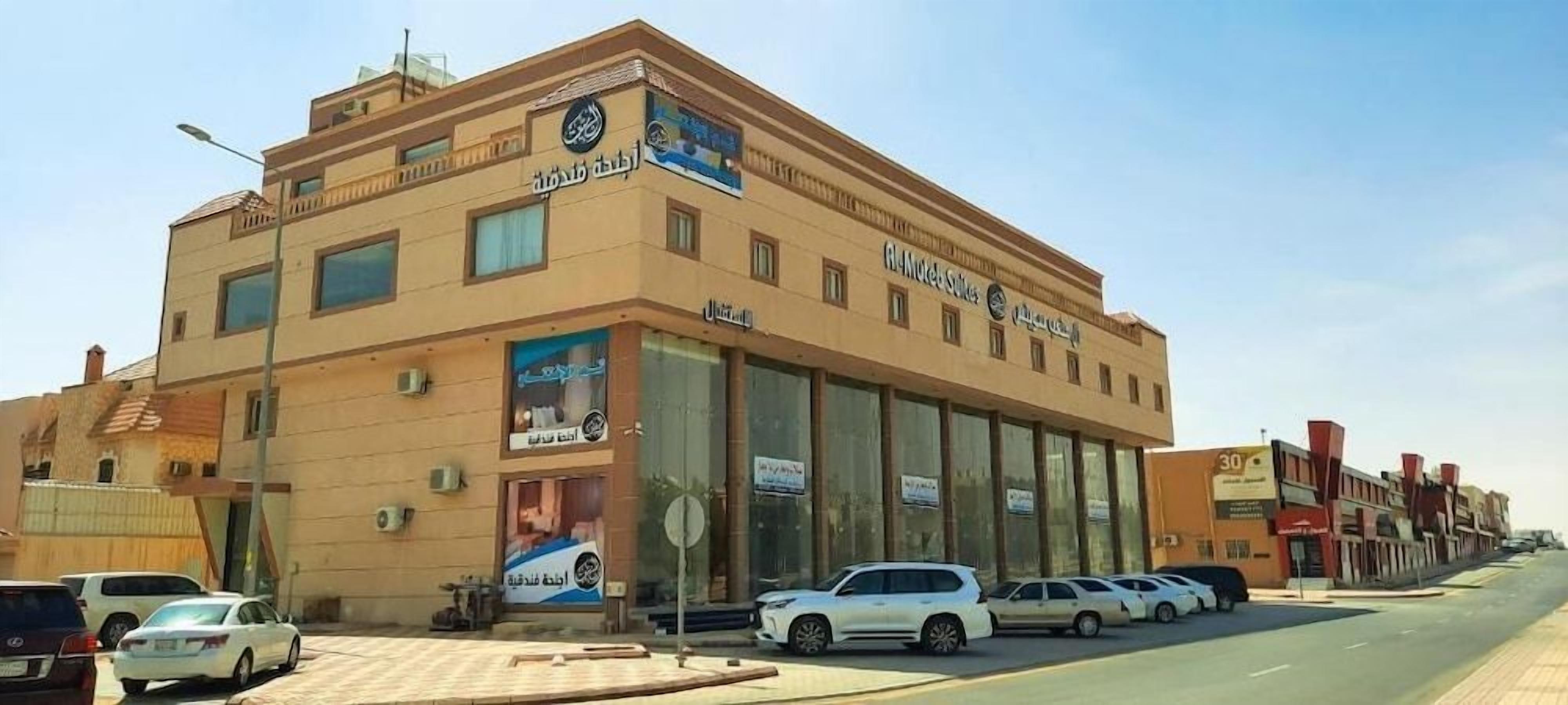 A multi-story building with signage for 'Al-Motors' and 'Al-Motors Hotels'.