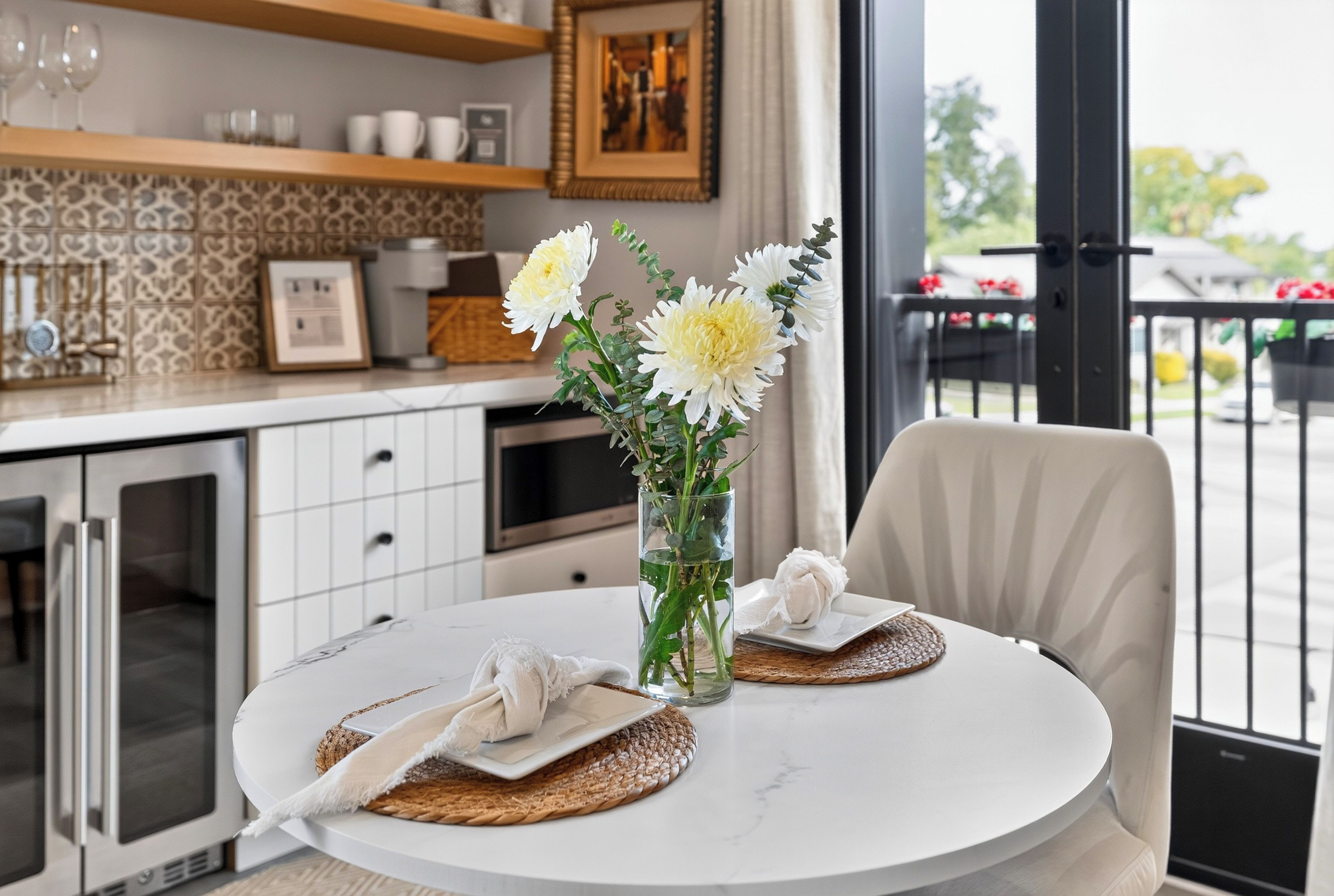Relax in the welcoming lounge, with a comfortable sofa, a round coffee table, and an inviting indoor-outdoor flow.