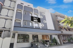 A modern building with a sign that reads 'Collection Company-Serviced.' - Collection O Tourist Complex Area (Agra)