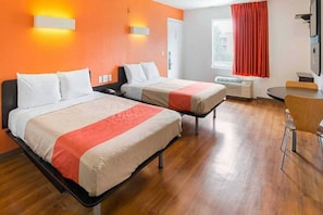 A hotel room with two beds, a desk, a chair, and a window with curtains. - Cozy 2 FULL BEDS | Nsmk (GRAND PRAIRIE)