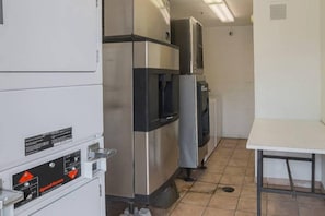 A kitchen with stainless steel appliances, including a refrigerator, oven, and microwave. - Cozy 2 FULL BEDS | Nsmk (GRAND PRAIRIE)