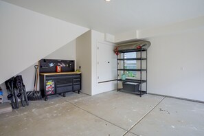 A room with a pegboard wall, a black tool cabinet, and a metal shelving unit. - 4 Mi to Slopes! Eden Home w/ Private Hot Tub (Eden)