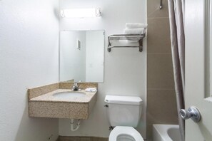 A bathroom with a sink, toilet, and shower. - 1 King Bed | Smoking, Micfridge (Fort Worth)