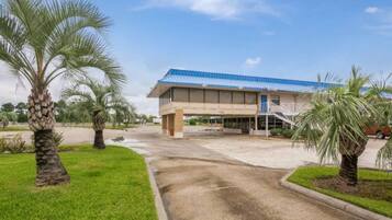 A building with a blue roof and a covered entrance area.