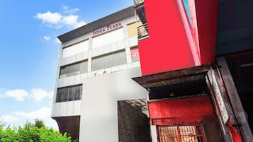 A multi-story building with signage for 'INDRA PLAZA' and 'H RIA'.