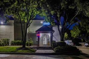 A building with an 'OFFICE' sign, a glass door entrance, and a 'OPEN' sign. - 2 Full Beds | Non-smoking (Arlington)
