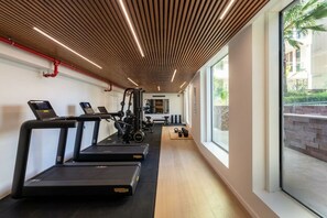 A gym with treadmills, weight machines, and exercise balls. - Seaside suite at 42 Eilat (Eilat)