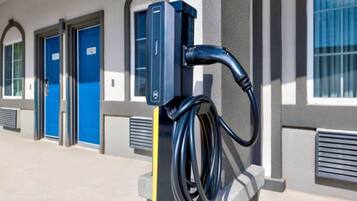 A parking area with electric vehicle charging stations.