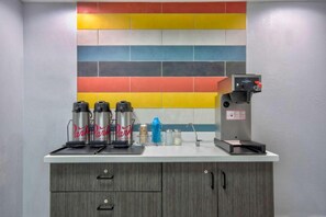 A kitchen area with a coffee machine, three thermos flasks, and a colorful tile backsplash. - Cozy 2 Full Beds | Nsmk, Kitchen (Rosenberg)