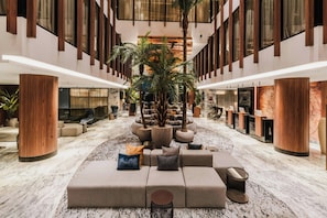 A spacious lobby with a central seating area, large windows, and a high ceiling. - Idou Malabata Beach & Spa (Tangier)