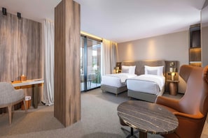 A hotel room with a bed, two bedside tables, a chair, a desk, and a large window. - Idou Malabata Beach & Spa (Tangier)