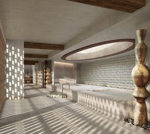 Un interior modern amb una zona d'estar central, una paret amb textura i una columna decorativa.