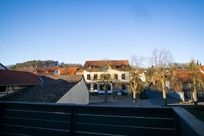 A residential area with houses, a clear sky, and a tree-lined street. - Holiday apartment with 2 bedrooms (Bad Sachsa)