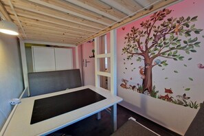 A room with a bed, a desk, and a wall mural. - Holiday apartment with 2 bedrooms (Heiligenhafen)