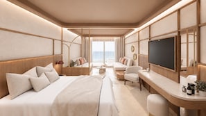 A modern hotel room with a large bed, a desk, a television, and a seating area with a view. - AKASHA Reserve (Hersonissos)