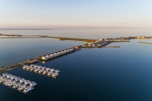A marina with multiple docked boats and a long pier extending into the water. - Holiday apartment with 2 bedrooms (Olpenitz)