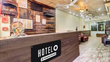 A hotel reception desk with a wooden finish, a 'HOTEL' sign, and a 'Company-Service' label.