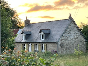 A stone house with a sloped roof, two dormer windows, and a chimney. - Cottage 'La Sejannerie' with Private Terrace, Private Garden and Wi-Fi (Gathemo)
