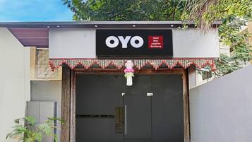 A hotel entrance with a large sign reading 'OYO Hotel Blue sapphire Residency'.
