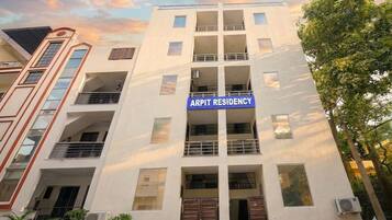 A multi-story building with a sign reading 'ARPit Residency' indicating it is a residential complex.