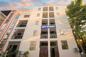 A multi-story building with a sign reading 'ARPit Residency' indicating it is a residential complex. - Arpit Residency 28 (Gurugram)