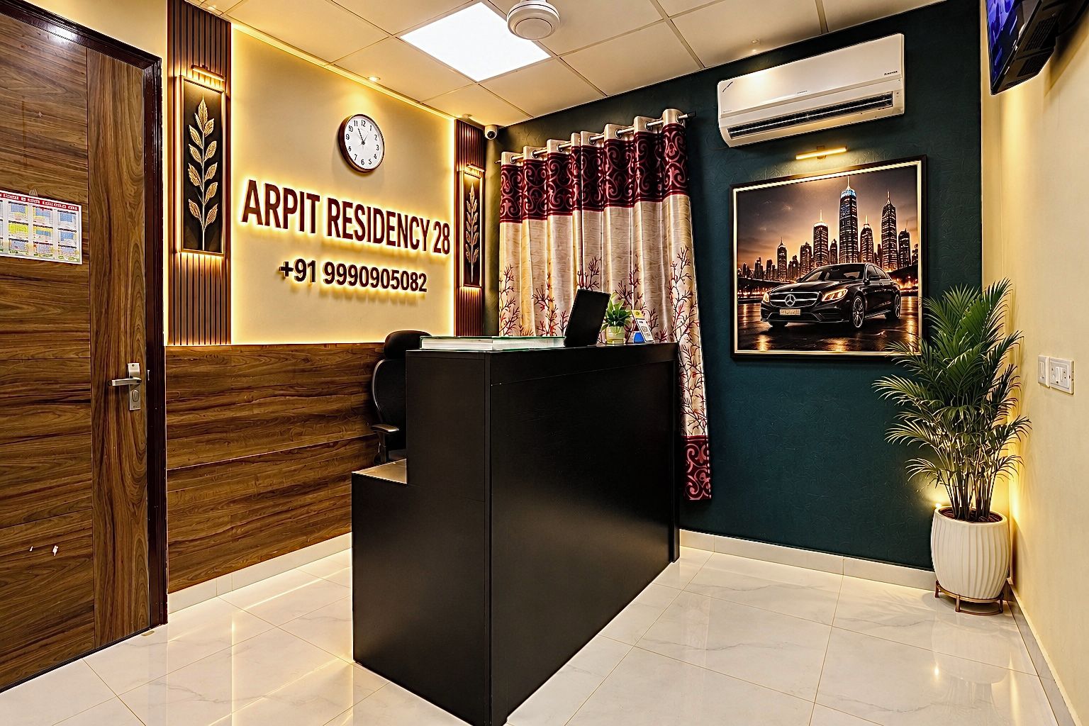 A reception desk with a clock, a cityscape poster, and a contact number.