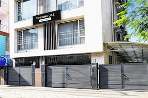 A building with a sign reading 'TOWNHOUSE Company-Serviced'. - Townhouse New Town (Barasat)