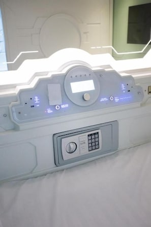 A control panel with a keypad and illuminated buttons, likely for room access or security. - CAPSLOCK (Almaty)