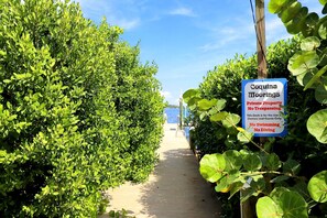 A pathway leading to a dock with a sign indicating it's private property and no trespassing. - Gulf + Bay Views · Boat Dock · Bradenton Beach (Bradenton Beach)