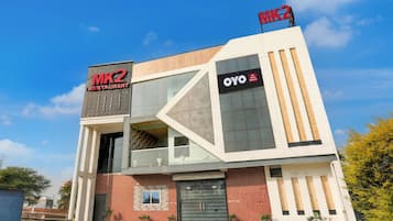 A modern building with a prominent MK2 Restaurant sign and an OYO Hotel & Restaurant sign.