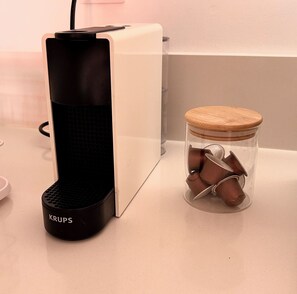 A coffee machine and a glass jar with a wooden lid on a countertop. - New Listing (Benicasim)
