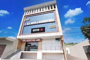 A hotel with a reception area and a sign for 'D.P Hotel & Banquet Hall'. - Hotel O R K HOTEL (Fatehabad)